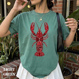 comfort colors shirt with lobster design styled with denim outfit