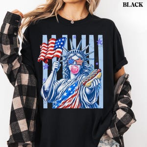 America 250 retro shirt with Statue of Liberty wearing flag sunglasses.
