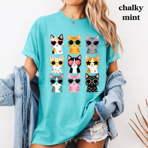 Funny cat print tee with colorful feline artwork.