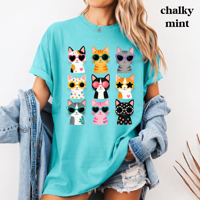 Funny cat print tee with colorful feline artwork.