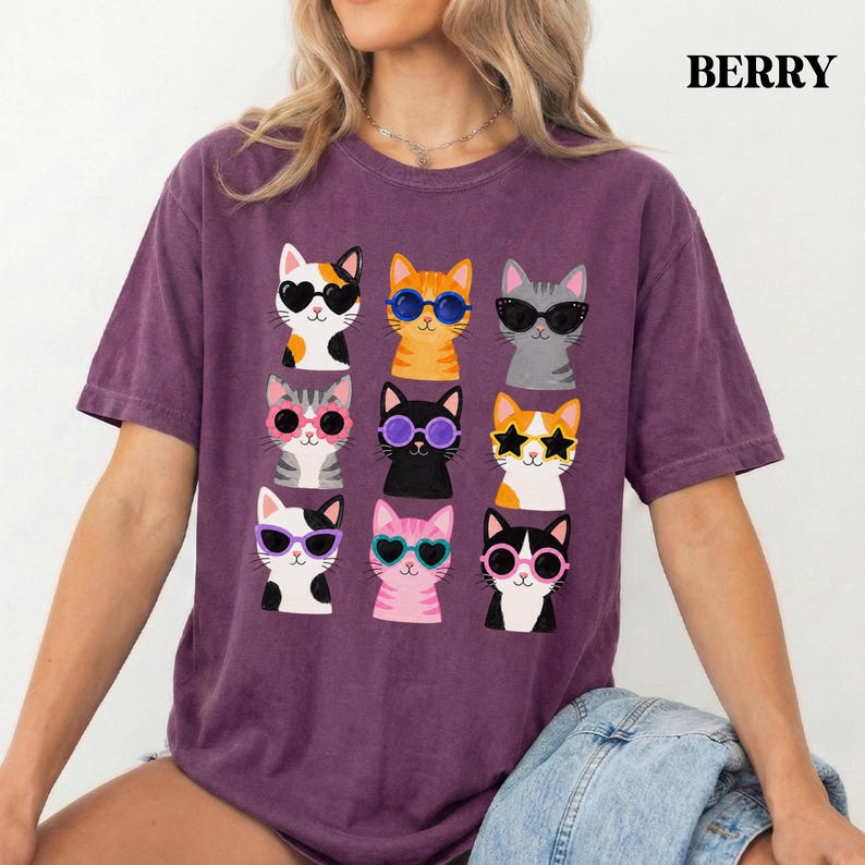 Funny feline t-shirt with bright and cheerful cat artwork.
Pet lover shirt featuring colorful kitty character design.
Comfort Colors® cute cat tee with playful graphic.
Cat lover gift t-shirt with colorful illustrated cats.