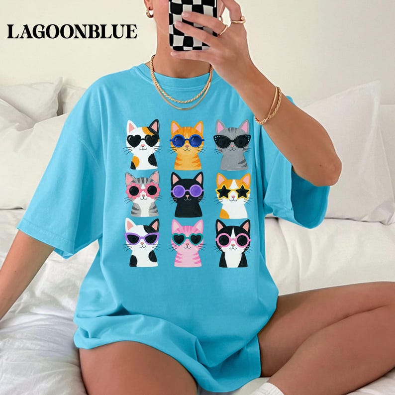 Cute cat shirt featuring colorful kitty graphic artwork.