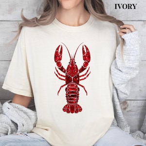 moss green shirt with red lobster design styled in casual outfit