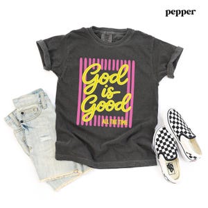 Christian girl shirt with bold yellow faith quote.