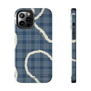 May include: A phone case with a blue plaid pattern and cream-colored floral garland design. The case has a camera cutout and side buttons. The text "Pineapple Paradise" is printed on the bottom.