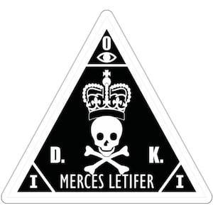 May include: Black and white sticker with a triangle shape. The triangle has a skull and crossbones with a crown above it. The text "D.K. MERCES LETIFER" is below the skull and crossbones. The text "O" is at the top of the triangle with an eye inside the letter.