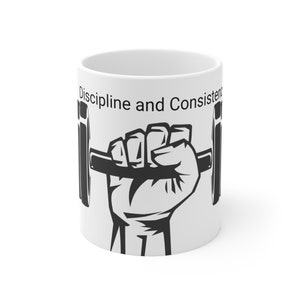May include: White ceramic mug with a black and white illustration of a hand lifting a barbell. The text "Discipline and Consistency" is printed on the mug.