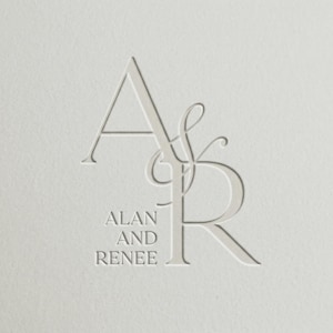 May include: A minimalist design featuring the intertwined letters "A" and "R" in a light, embossed style. Below the initials, the names "ALAN" and "RENEE" are printed in a simple, sans-serif font. The design is set against a textured, off-white background.