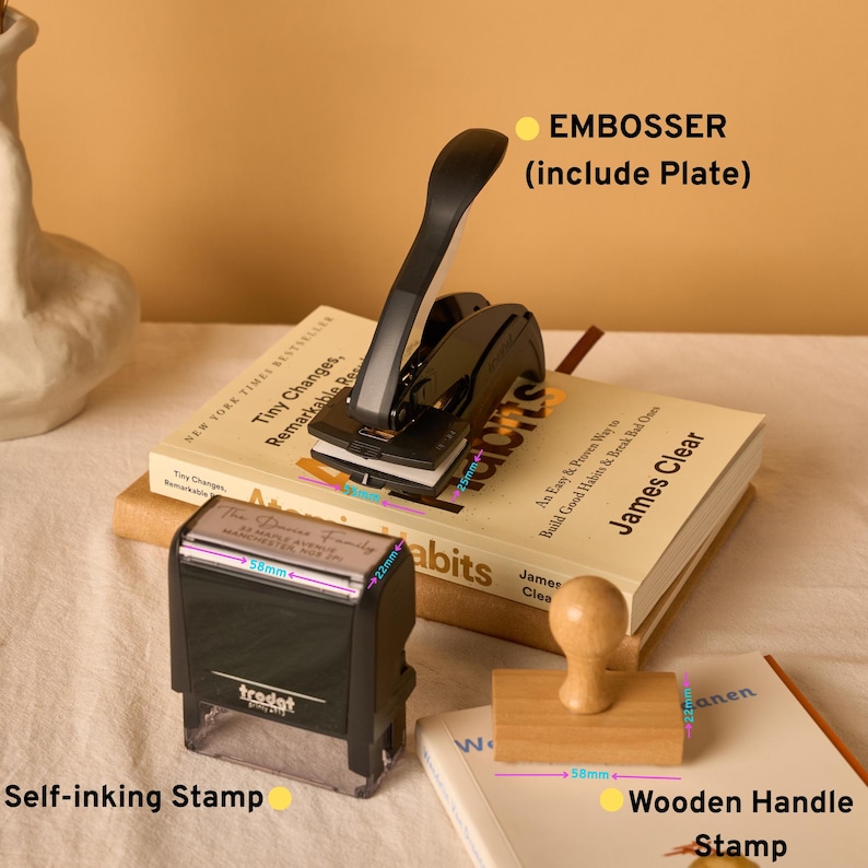 May include: A black metal embosser with a plate, a black self-inking stamp, and a wooden handle stamp. The embosser has a 25mm measurement, the self-inking stamp measures 58mm by 22mm, and the wooden handle stamp measures 58mm by 22mm.