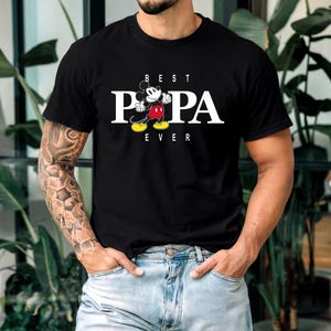 May include: Black t-shirt with a white graphic of Mickey Mouse and the text "BEST PAPA EVER".