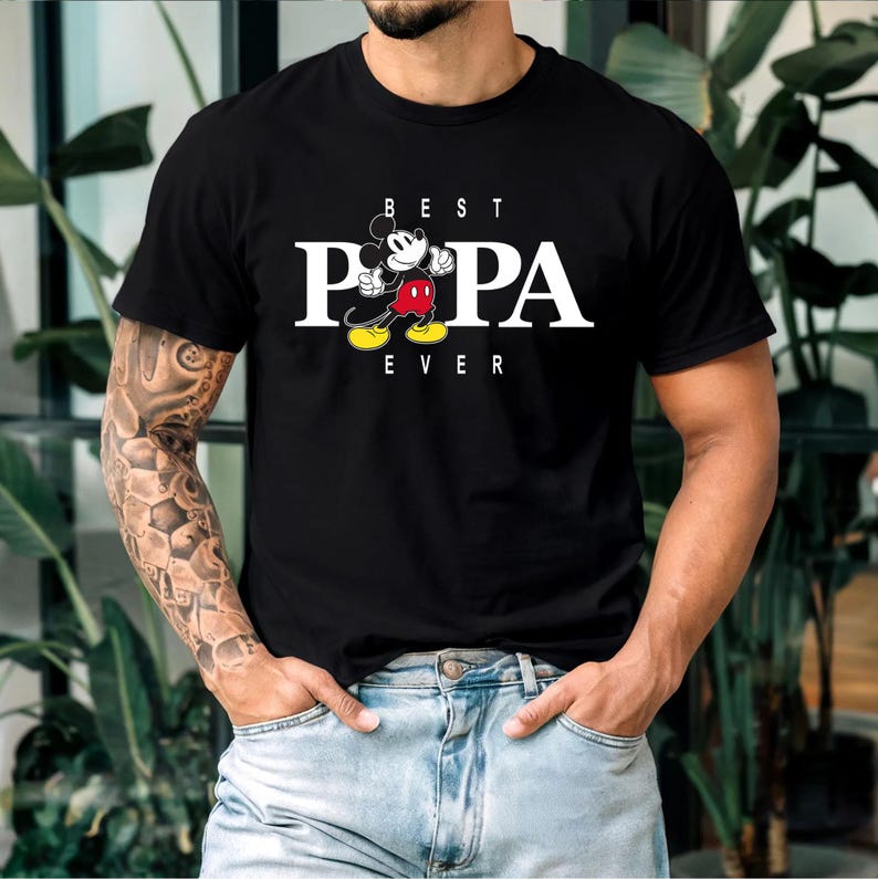 May include: Black t-shirt with a white graphic of Mickey Mouse and the text "BEST PAPA EVER".