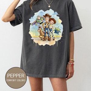 May include: A rustic wooden sign with the text "Welcome to our home" in white lettering. The sign features a distressed finish and a simple, inviting design, perfect for entryway decor.