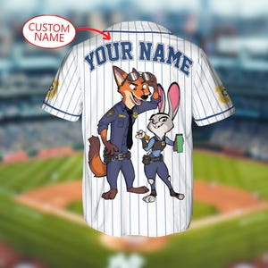 May include: White baseball jersey with blue pinstripes and the text "YOUR NAME" across the back. Features a cartoon fox and rabbit in police uniforms. The jersey has a "CUSTOM NAME" option.