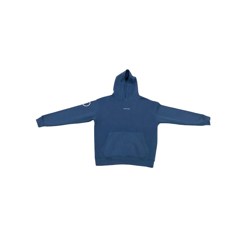 May include: A blue hoodie with a front pocket and a hood. The hoodie has a white circular design on the left sleeve and small white text on the chest. The hoodie is made of a soft material.