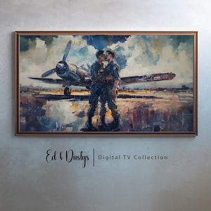 Puede incluir: Una pintura de dos hombres con uniformes militares besándose frente a un avión vintage. Los hombres están de pie en una pista con un cielo nublado en el fondo. La pintura está en un marco de madera.