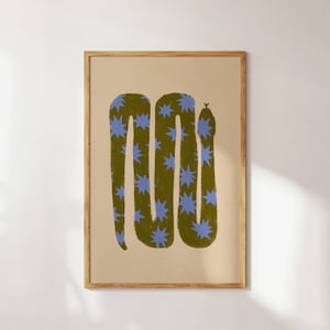 May include: A framed print of a green snake with a blue star pattern. The snake is curled up in a coil shape.