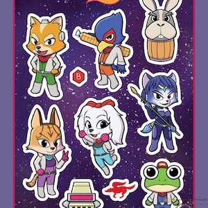 May include: A sticker sheet featuring Team Starfox characters including a fox, a bird, a rabbit, a cat, and a frog on a purple space background. The text reads TEAM STARFOX, B, and @violet.grotto. Includes a small red fox icon and a white ship component.