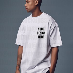 luxury streetwear photo mockup of male standing at angle in white oversized t shirt