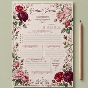 Könnte beinhalten: Eine rechteckige Dankbarkeitstagebuch-Seite mit Blumenillustrationen aus roten und rosafarbenen Rosen in den Ecken. Der Text umfasst Gratitude Journal, Datum, Stimmungssymbole und Abschnitte für tägliche Reflexionen, Freundlichkeiten und Affirmationen, mit einem Bleistift.