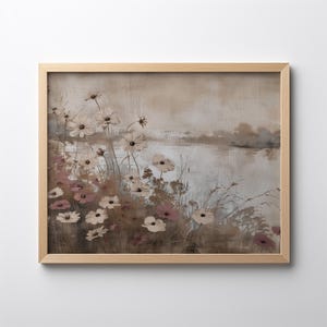 May include: A framed painting of a landscape with a lake and a field of white and pink flowers. The background is a soft, muted brown and gray.