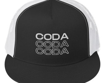 May include: Black and white trucker hat with the word "CODA" embroidered in white three times. The hat features a black front panel and brim, with a white mesh back.