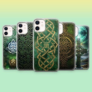 May include: A collection of five phone cases with Celtic knot designs. The cases feature intricate patterns in shades of green and gold, with clear protective covers. The designs include crosses, spirals, and interwoven lines, set against a gradient green background.