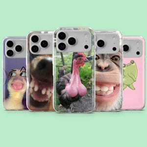May include: Five phone cases with amusing animal designs. The cases display images of a duck, a dog, a chicken, a monkey, and a frog. Each case has a clear protective cover and a camera aperture.