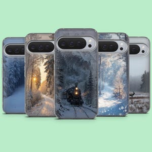May include: A collection of five phone cases featuring winter landscape designs. The cases display scenes of snowy forests, a train on tracks, and a deer in a field. The cases have a clear border and a camera cutout.