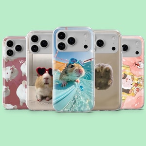 May include: A collection of clear phone cases featuring adorable hamster designs. One case showcases a hamster in sunglasses in a pool, while others display hamsters with heart-shaped sunglasses and other cute graphics. The cases have a protective design.