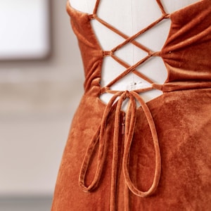 a dress on a mannequin with an open back