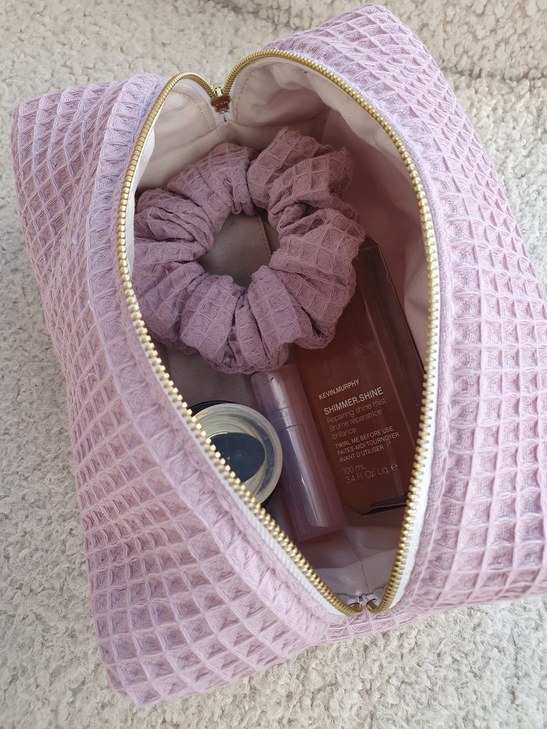 Interior view of the makeup bag, showcasing practical organization for cosmetics and toiletries.