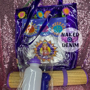 May include: A purple clear tote bag with a floral design and a smaller clear pouch inside. The tote bag has a purple strap and a straw mat with a purple strap. A clear plastic bag contains a purple water bottle and a purple bottle opener.