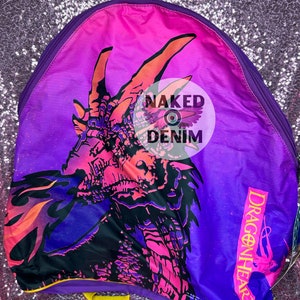 May include: Purple and pink backpack with a dragon graphic and the text "Dragonheart".