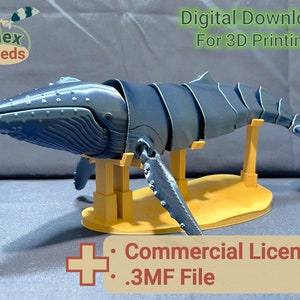 Puede incluir: Un modelo de ballena azul impreso en 3D sobre un soporte amarillo. El modelo est&aacute; segmentado y articulado. La imagen incluye el texto "Descarga digital para impresi&oacute;n 3D" y "Licencia comercial .3MF File".