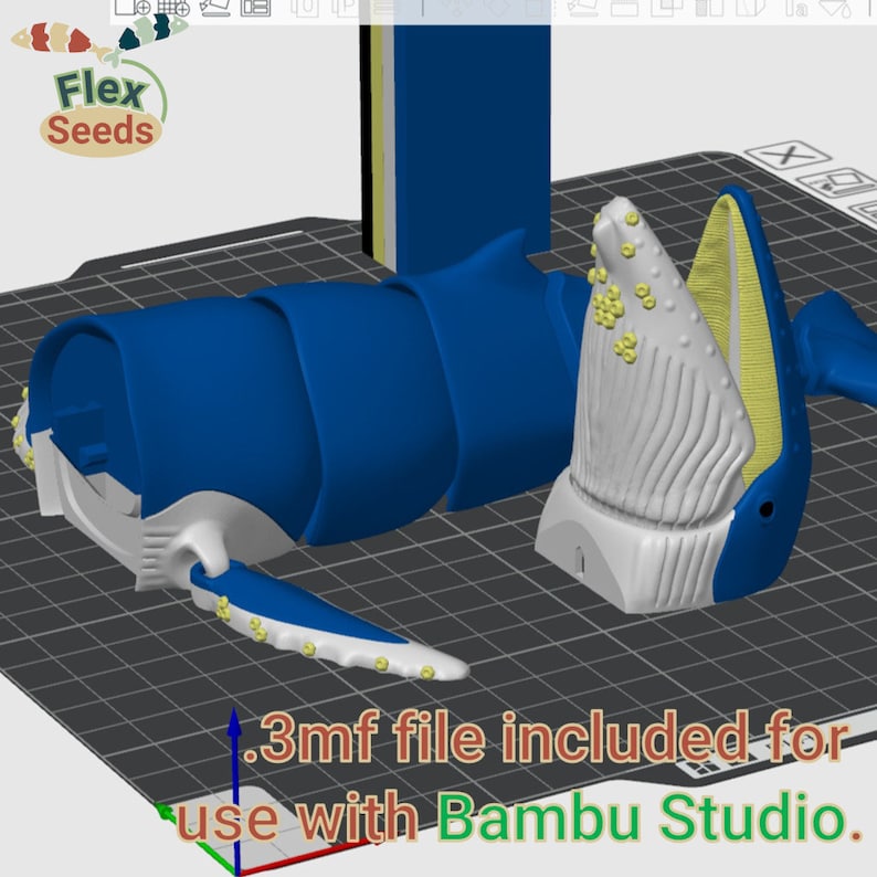 Puede incluir: Un modelo de ballena impreso en 3D, impreso en azul, blanco y amarillo. El modelo est&aacute; en varias piezas y est&aacute; listo para ser ensamblado. La imagen incluye el texto ".3mf file included for use with Bambu Studio."