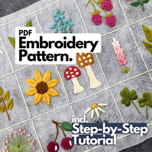 Peut inclure: Une grille en tissu gris avec des motifs botaniques brodés incluant un tournesol jaune, des champignons rouges et blancs, des baies roses, des fleurs bleues, des feuilles vertes, une marguerite blanche et des cerises. Texte PDF Embroidery Pattern et incl. Step-by-Step Tutorial.