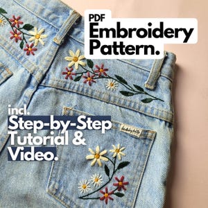 May include: Pale blue denim jeans featuring embroidered floral designs in red, yellow, and white. The text "PDF Embroidery Pattern" is visible, along with "incl. Step-by-Step Tutorial & Video."