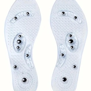 May include: A pair of clear plastic foot massage insoles with raised bumps and silver metal balls. The insoles are designed to stimulate the feet and improve circulation.
