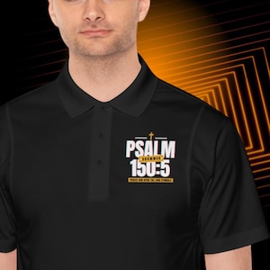 May include: Black polo shirt with a white and gold graphic design that says "PSALM DRUMMER 150:5 PRAISE HIM UPON THE LOUD CYMBALS".