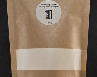 May include: A brown paper pouch with a white label that says "dry shampoo refill recharge de shampooing sec basalt B e 340g".