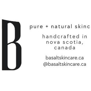 May include: A minimalist logo for Basalt skincare, featuring a large black 'B' beside the word 'basalt' in a vertical orientation. Text below reads 'pure + natural skincare' and 'handcrafted in nova scotia, canada'.
