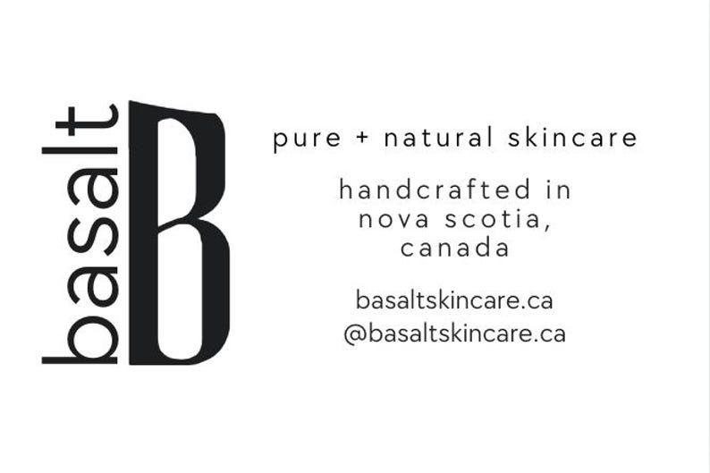 May include: A minimalist logo for Basalt skincare, featuring a large black 'B' beside the word 'basalt' in a vertical orientation. Text below reads 'pure + natural skincare' and 'handcrafted in nova scotia, canada'.