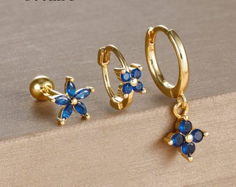 Set diamanten geslepen bloemoorbellen met blauwe zirkoon - koperen ring- en oorknopjes