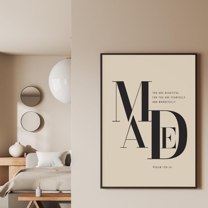 Beige and black "fearfully and wonderfully made" Psalm 139:14 oversized MADE typography art print in black frame on bedroom wall, minimalist Christian scripture wall art digital download