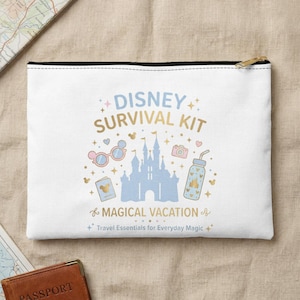 May include: White zippered pouch with a Disney Survival Kit design. The design includes a blue castle, pink sunglasses, a camera, and a water bottle. Text reads "Disney Survival Kit" and "Magical Vacation".