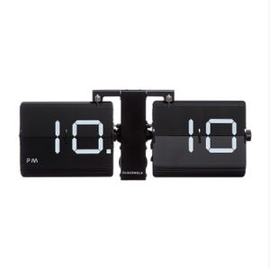May include: A black flip clock with a central vertical support featuring the brand name CLOUDNOLA in white text. The clock displays the time 10:10 with white digital numerals on two separate black panels, with a small PM indicator on the left side.