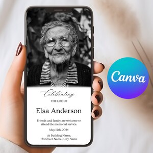 May include: Black and white photo of an older woman with glasses on a mobile phone screen. The text on the screen reads "Celebrating the life of Elsa Anderson. Friends and family are welcome to attend the memorial service. May 12th, 2024. At Building Name, 123 Street Name, City Name."