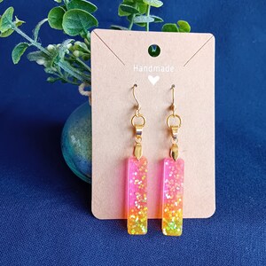 Rectangular earrings in pink and orange glitter resin