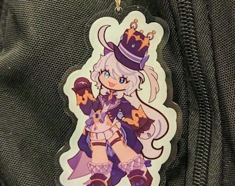 May include: A purple and white anime character keychain with a crown and a purple and gold hat. The character is wearing a white dress with a purple and gold trim and a purple and gold sash. The keychain is made of clear acrylic.