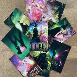 May include: A collection of nine movie posters for the upcoming film "Wicked". The posters feature the main characters, Elphaba and Glinda, in various scenes from the movie. The posters are all in a dark green and purple color scheme with the title "Wicked" in a bold, white font.